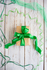 Christmas gift box with red ribbon and spruce branch on the white background over pine cones,isolated,top view,flat lay,space for text