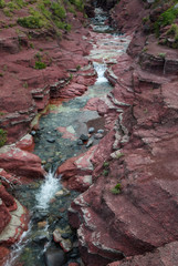 Canada, Waterton-Glacier International Peace Park. Abstract design of the rock formations and streambed of Red Rock Canyon
