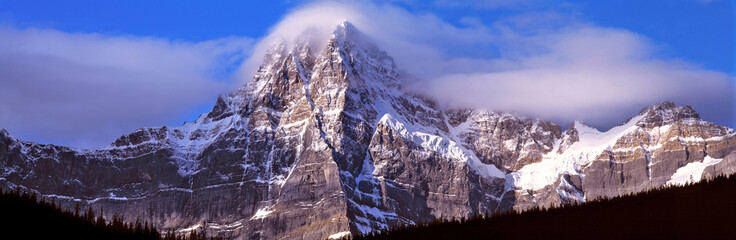Canada, Alberta, Mt. Chephren. Mount Chephren wears a mantle of clouds in Banff NP, a World Heritage Site, Alberta, Canada. © Ric Ergenbright/Danita Delimont