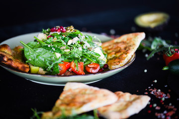 fresh quinoa salad with mix of vegetables & focaccia bread