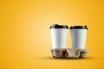Paper white coffee cup isolated on a yellow background. mockup, layout, copy space