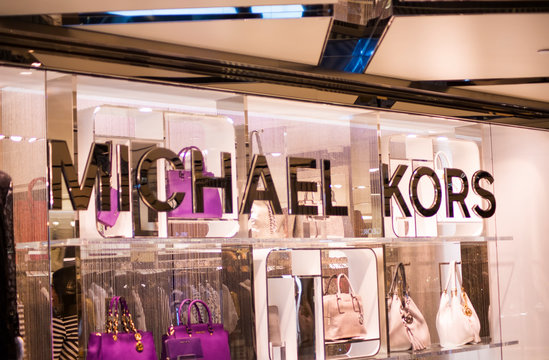 View at Michael Kors shop. Michael Kors  is a New York City-based fashion designer widely known for designing classic American sportswear for women.