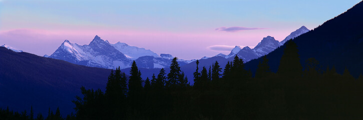 Canada, British Columbia, Mt Terry Fox. Mount Terry Fox turns periwinkle in the settling dusk,...
