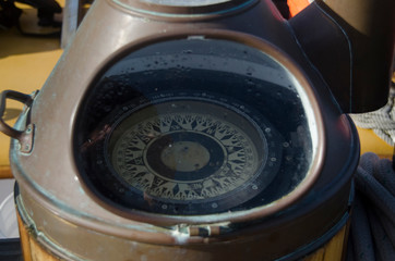 Obraz premium Compass on Deck of SV Maple Leaf, Gulf Islands, British Columbia, Canada.