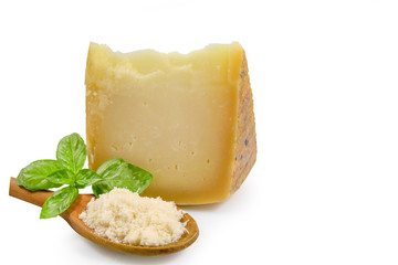 piece of cheese or Italian cheese with fresh green basil isolated on white background with clipping path.