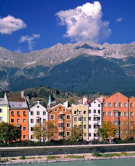Austria, Innsbruck. Colorful homes line the Inn River in Innsbruck, Austria.
