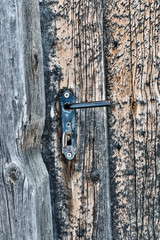 Austria, Kals am Grossglockner. Simple door latch of small wayside chapel