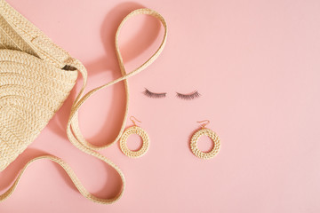 Beauty products, everyday make-up vibrant background. Cosmetic essentials - eyelashes, eyeshadow, lipstick and nail polish on blue, flat lay, top view