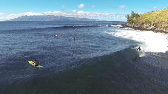 Aerial shot of sufers in Hawaii (2)