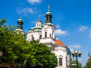 Fototapeta na wymiar Czech Republic, Prague. Domes of the Church St. Nicolas in Prague.