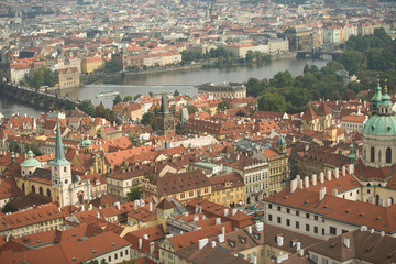 Fototapeta na wymiar CZECH REPUBLIC, Prague. View of Prague and the Charles Bridge from the Bell Tower, St. Vitus Cathedral. 