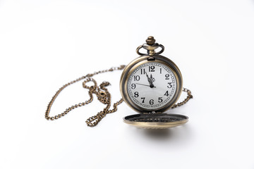 Old pocket watch closeup isolated on white background