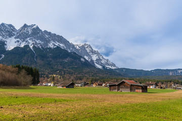 Farmed fields in the village of Grainau at the foot of the Alps with the Zugspitze in the background.