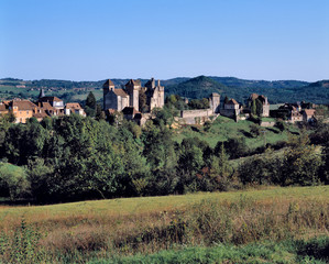 Fototapeta na wymiar France, Curemonte. The town of Curemonte glistens in the afternoon sun in the Limousin Region of France.