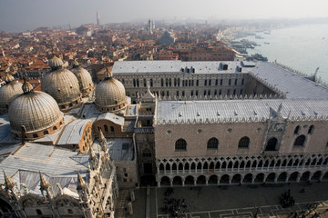 Fototapeta na wymiar Italy, Venice. Doge's Palace and domes of St. Mark's Basilica from the Campanile.