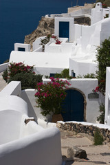 Greece, Santorini, Thira, Oia. White villas with blue doors.