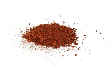 Cayenne pepper. Pile crushed red cayenne pepper, dried chili flakes and seeds isolated on white background