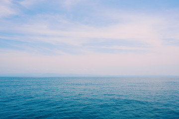 Blue sea and blue sky minimalistic background.