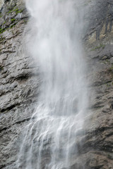 Obraz premium High waterfall falling from the cliff