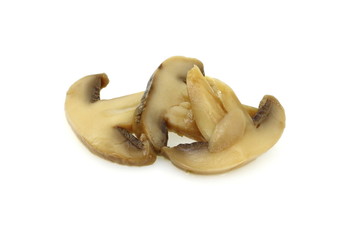 canned mushroom pieces on a white background. 