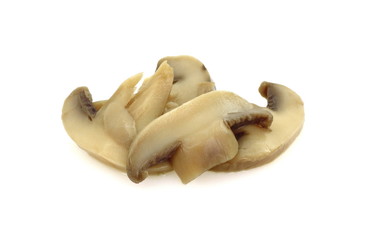 canned mushroom pieces on a white background. 