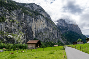 Fototapeta na wymiar Walking road through waterfall valley, Switzerland
