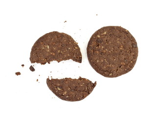 Round chocolate whole wheat biscuit, cookie with raisins isolated on white background. Chocolate Biscuits with whole-wheat (wholemeal) flour isolated on white background 