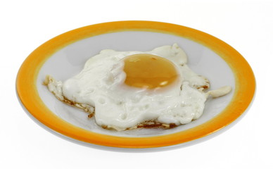 Fried egg on a plate isolated on white background.