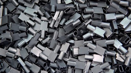 A large number of small plastic parts in the factory.