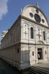 Fototapeta na wymiar Italy, Venice. Church of Santa Maria dei Miracoli beside canal.