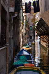 Fototapeta na wymiar Italy, Venice. Boats in canal.
