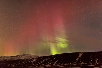 North Iceland, Near Akureyri. The northern lights glow in unbelievable colors.