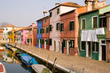 Fototapeta na wymiar Italy, Burano. Colorful houses of line a canal.