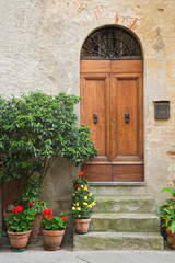 Fototapeta na wymiar Italy, Tuscany, Pienza. Close-up of doorway to a residence. 