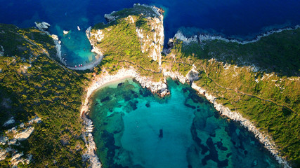 Aerial drone photo of iconic paradise bay of Porto Timoni with tropical deep blue and turquoise clear sea, Corfu island, Ionian, Greece - obrazy, fototapety, plakaty