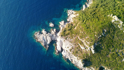 Aerial drone photo of iconic paradise bay of Porto Timoni with tropical deep blue and turquoise clear sea, Corfu island, Ionian, Greece