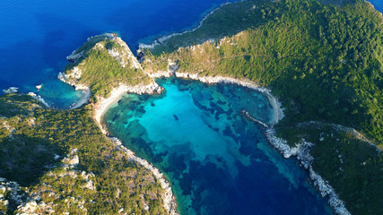 Aerial drone photo of iconic paradise bay of Porto Timoni with tropical deep blue and turquoise clear sea, Corfu island, Ionian, Greece
