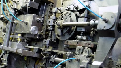 metal aluminum, copper wire tips fall into the basket of the manufacturing machine