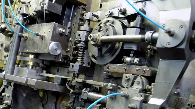 metal aluminum, copper wire tips fall into the basket of the manufacturing machine