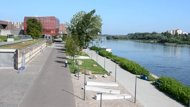 Sunny, summer day on the new promenade at Vistula riverbank in Warsaw, Poland. Warsaw boulevard with beautiful Vistula river view