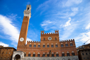 Obraz premium Sienna, Tuscany, Italy - Low angle view of an old world cathedral with a spire.
