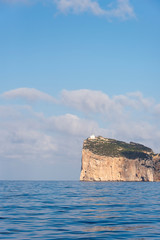 Italy, Sardinia, Bay of Alghero, Capo Caccia Light 610 feet off water on limestone cliffs, highest in Italy.