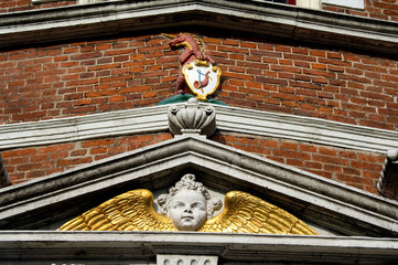 Netherlands (aka Holland), West Friesland, Hoorn. Historic facade with city crest & gold winged angel. © Cindy Miller Hopkins/Danita Delimont