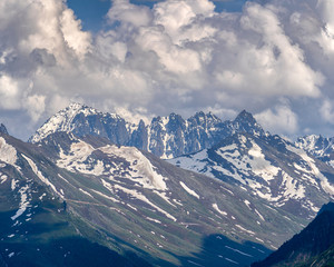 Fototapeta na wymiar Summits of snow-capped Kackar Mountains at the beginning of summer time. Kackar Mountains is located in the Eastern Black Sea Region of Turkey. 