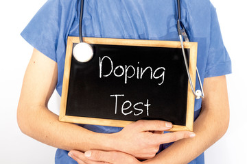 Doctor shows information on blackboard: doping test.  Medical concept.