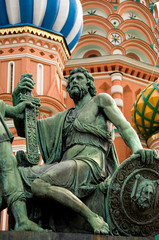 Russia, Moscow, Red Square. St. Basil's Cathedral (aka Pokrovsky Sobor or Cathedral of the Intercession of the Virgin on the Moat). Bronze monument to Minin & Pozharsky.