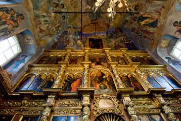 Russia, Golden Ring city of Uglich on the Volga. Church of St. Dmitry (aka Demetrius) on the Blood, interior. Ornate gold altar & painted fresco walls & ceiling. 