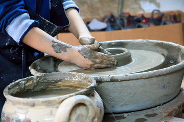 Romania, Maramures, Baia Spire, Guest house Casa Olarului. Pottery workshop. Young person making pottery.