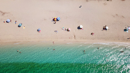 Aerial drone bird's eye view of famous and exotic sand tongue beach with clear emerald waters near castle of Santa Mavra in entrance of Lefkada island, Ionian, Greece