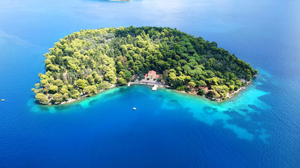 Aerial drone photo of iconic uninhabited island of Madouri in bay of Nydri and Mansion of...